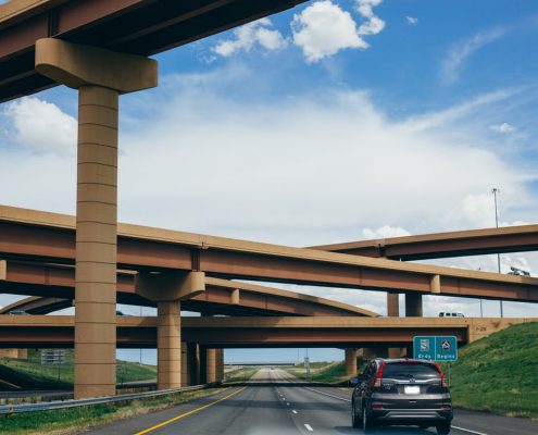 car driving under bridges